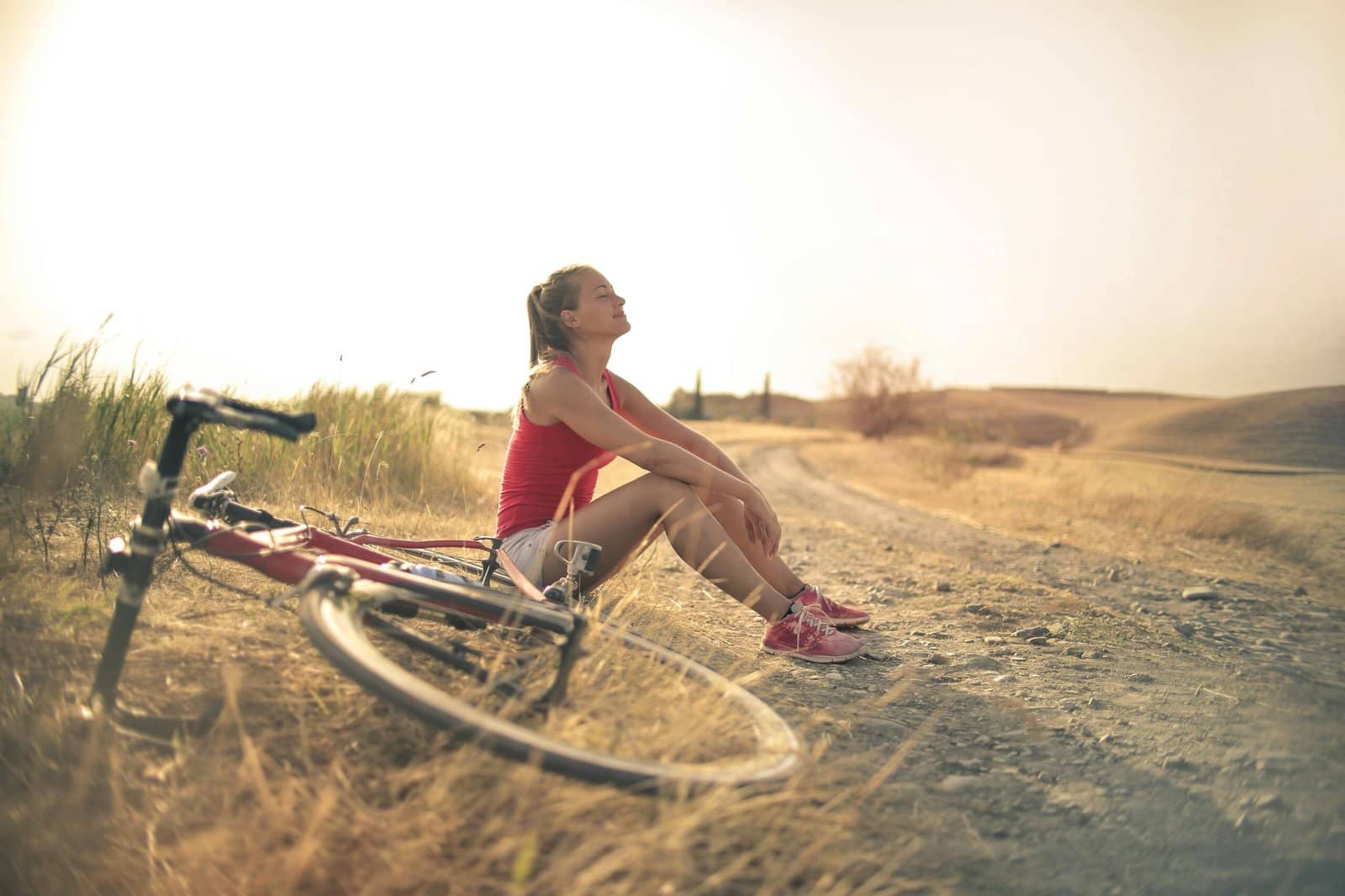 Blue Rabbit therapy-modality_Somatic Modalities-Girl sitting under the sun happily